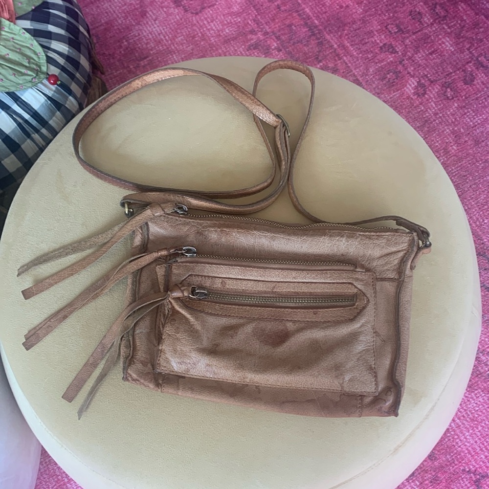 Leather 3 pocket shoulder or crossbody bag.